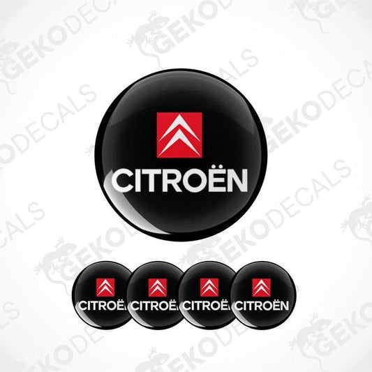 A set of black vinyl decals with the red CITROEN logo on them, typically used as car wheel stickers.