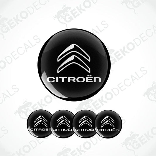 A set of four black vinyl stickers with the CITROEN brand logo on them.