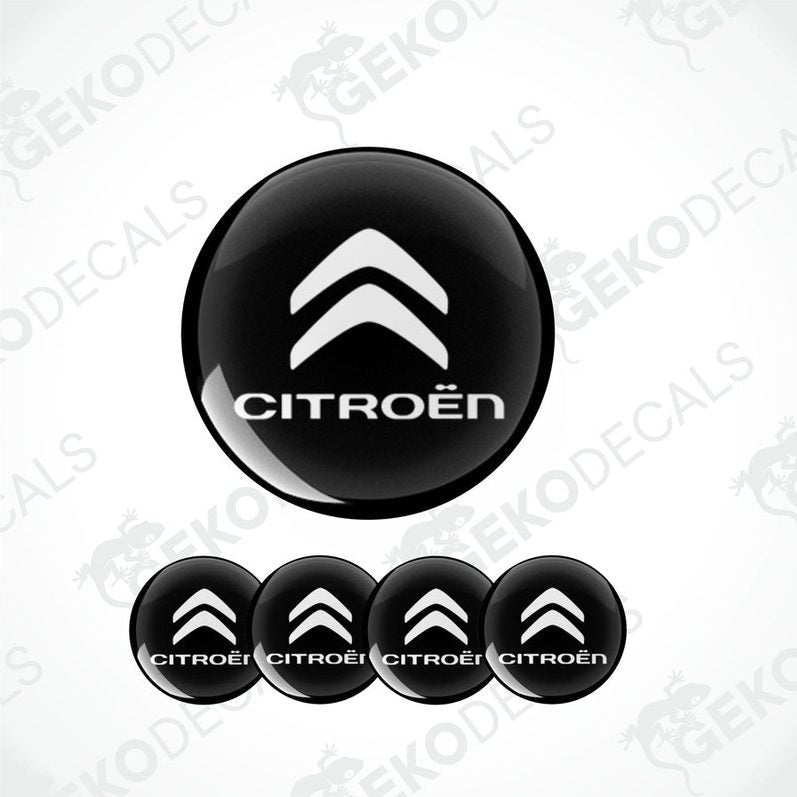 A set of four black vinyl stickers with the CITROEN brand logo designed for use on car wheels or caps.