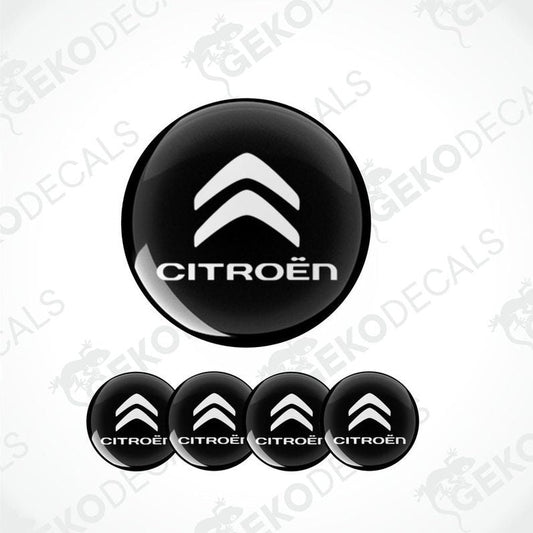A set of four black vinyl stickers with the CITROEN brand logo designed for use on car wheels or caps.