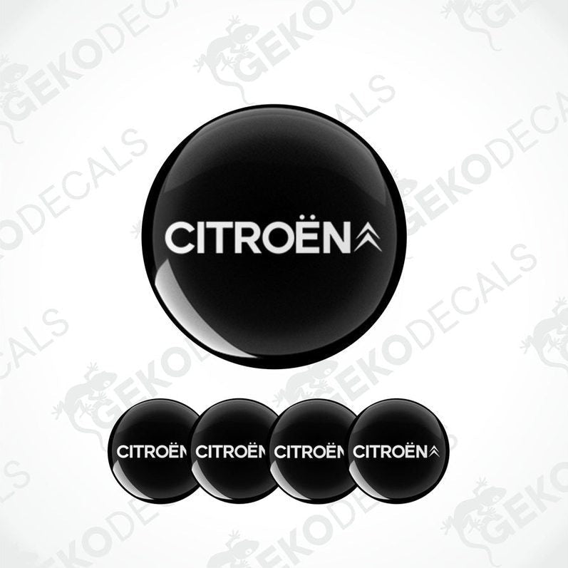 A set of four black vinyl stickers with the CITROEN brand logo on them.