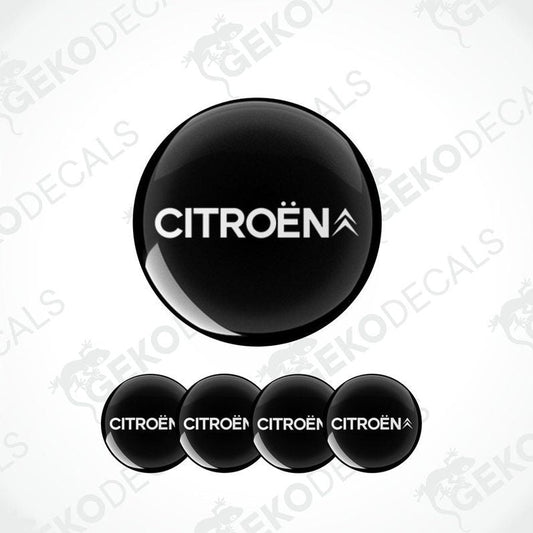 A set of four black vinyl stickers with the CITROEN brand logo on them.