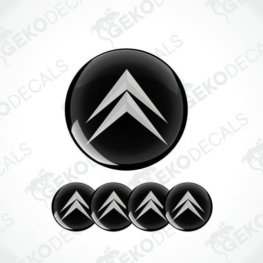 A set of four black vinyl stickers with a geometric pattern, designed for use as car decals or wheel caps.