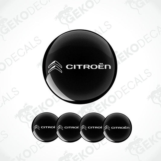 A set of four black vinyl stickers with the CITROEN brand logo on them.
