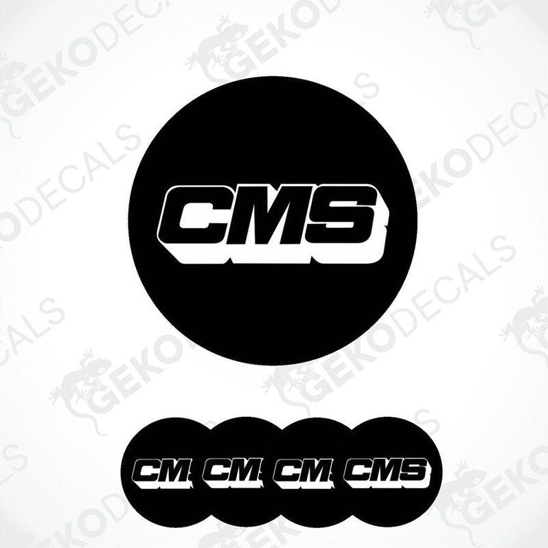 A set of four black round vinyl stickers with the CMS logo in white.