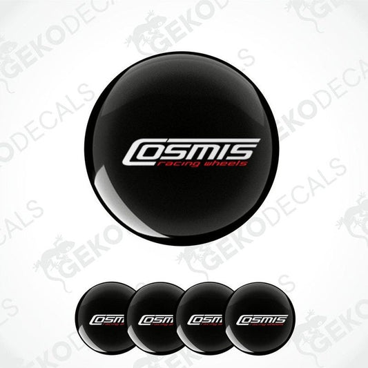 A set of four black vinyl decals with the text 'COSMIS' on them, displayed in a dome shape.