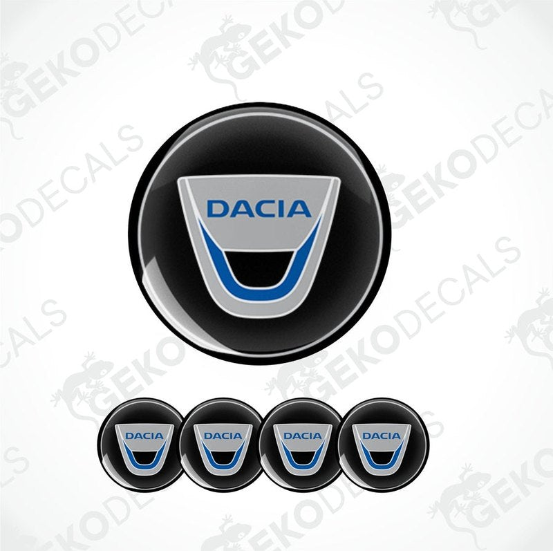 A set of four round DACIA branded vinyl stickers with a geometric design, including a black, blue, white, and silver color scheme.
