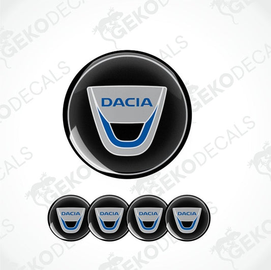A set of four round DACIA branded vinyl stickers with a geometric design, including a black, blue, white, and silver color scheme.