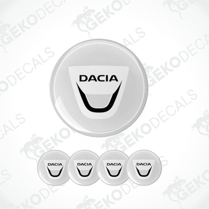 A set of four white vinyl stickers with the DACIA brand logo on them, designed for use as car decals.