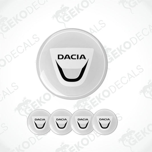 A set of four white vinyl stickers with the DACIA brand logo on them, designed for use as car decals.