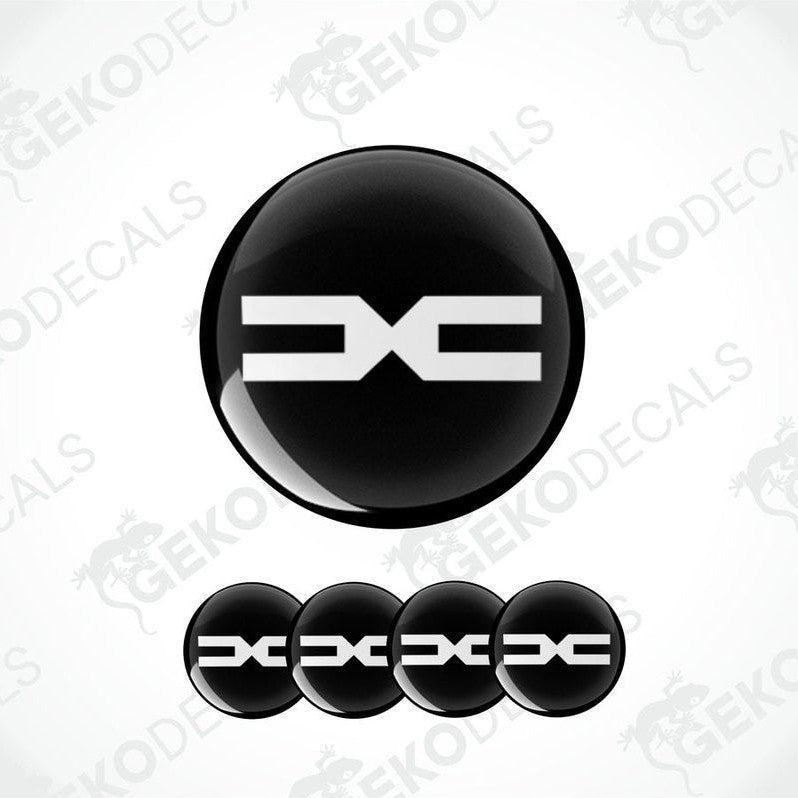A set of black vinyl decals with the DACIA logo displayed in a prominent central position and additional smaller decals arranged below.