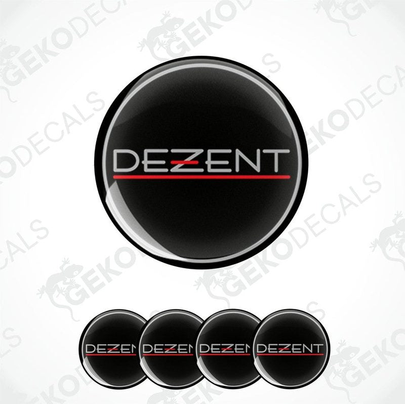A set of four round car decals with the brand name 'DEZENT' written in a stylized font, predominantly black color with a red horizontal line across the middle.