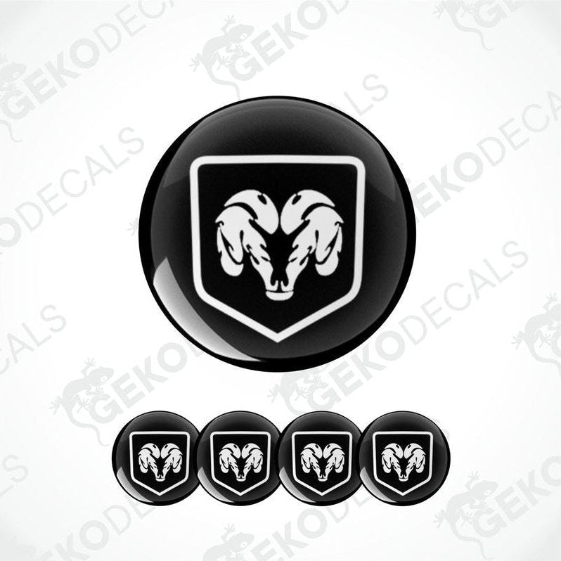 A set of black vinyl decals with a white DODGE ram's head design, intended for use as car wheel decals.