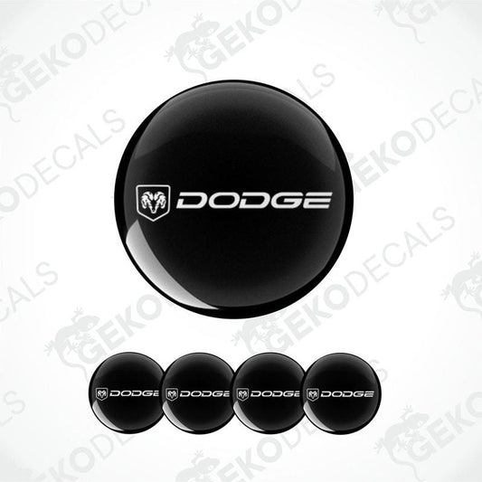 A set of black vinyl decals with the Dodge logo, including four round stickers and one larger oval sticker.