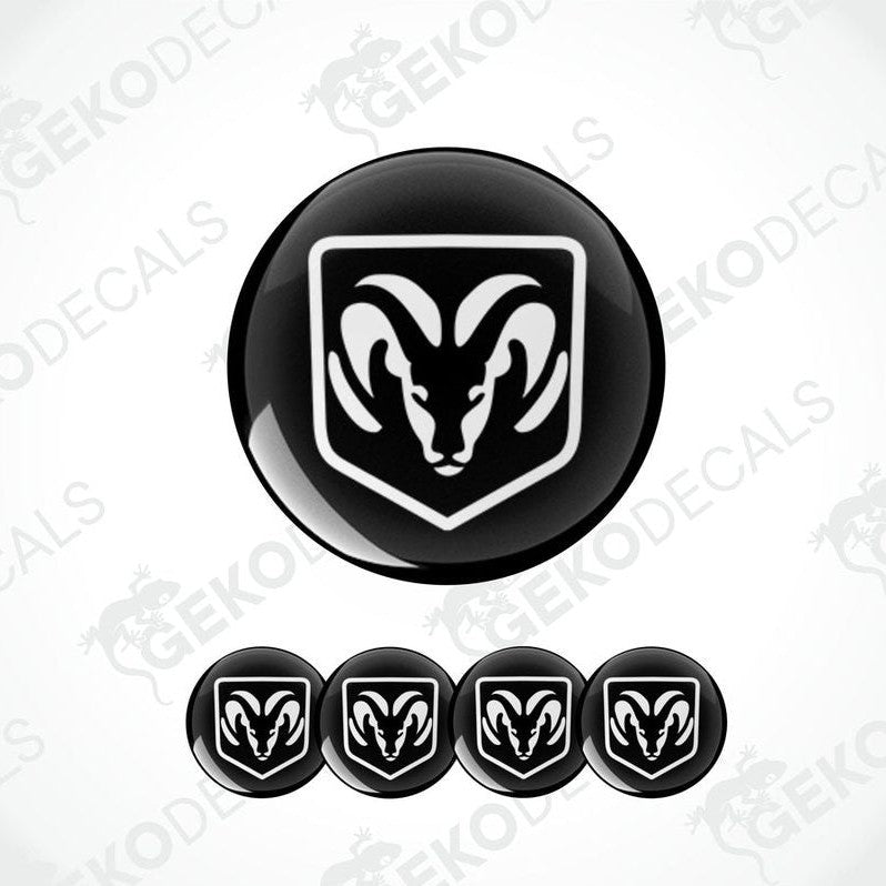 A set of black vinyl decals with a white DODGE ram's head design, intended for use as car wheel decals.