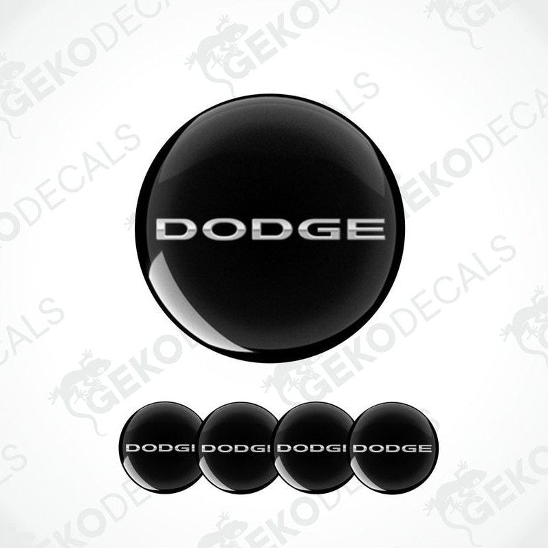 A set of four black vinyl stickers with the word silver metallic 'DODGE'.