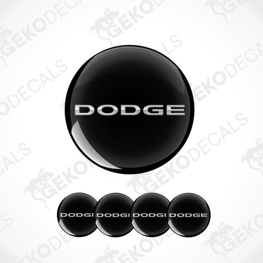 A set of four black vinyl stickers with the word silver metallic 'DODGE'.