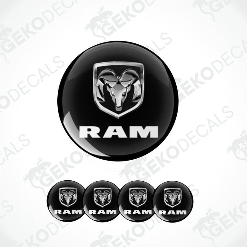 A set of four black vinyl stickers with the word 'RAM' and a ram logo printed on them.