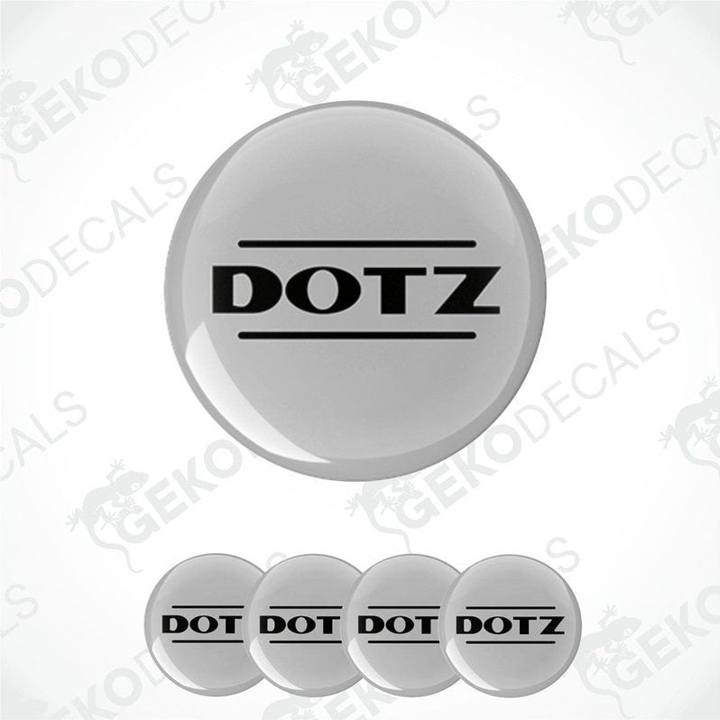 A set of four grey vinyl stickers with the word 'DOTZ' printed on them