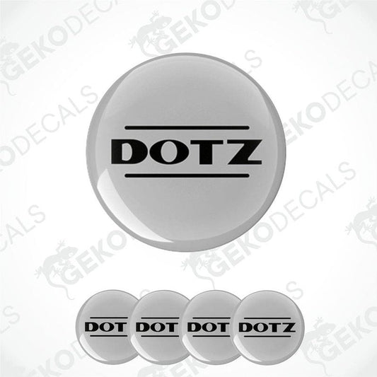 A set of four grey vinyl stickers with the word 'DOTZ' printed on them