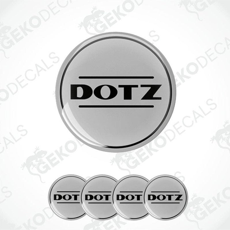 A set of four vinyl decals with 'DOTZ' branding, designed for use as car wheel caps.
