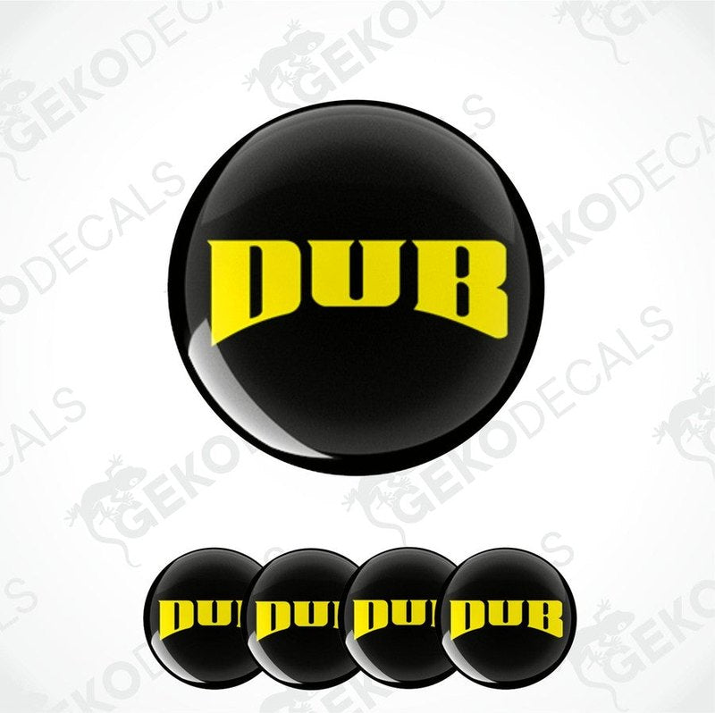 A set of four round black vinyl stickers with the word 'DUB' written in yellow.