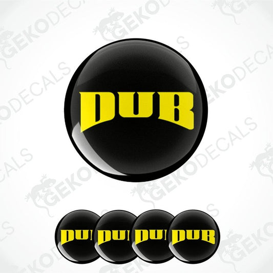 A set of four round black vinyl stickers with the word 'DUB' written in yellow.
