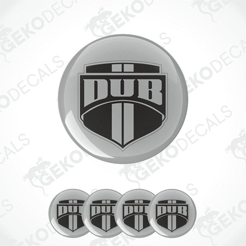 A set of four circular vinyl stickers with a polyurethane coating featuring the 'DUB' logo in black and silver.