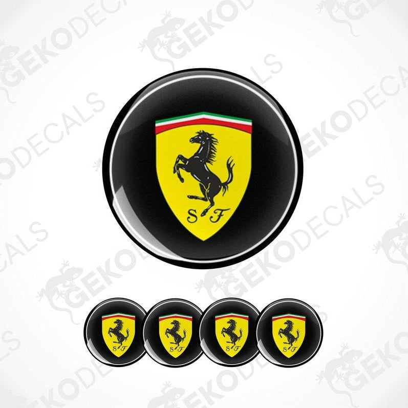 A set of four round vinyl stickers with a red, yellow, green, and black design featuring the Ferrari logo.