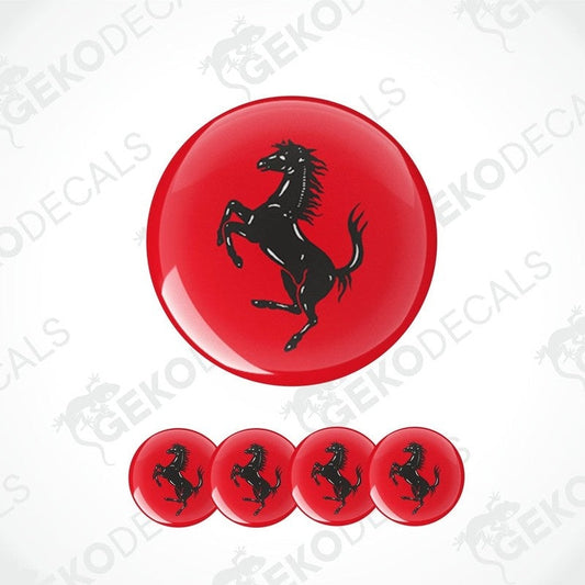 A set of red vinyl decals with a black FERRARI horse logo, designed for use on car wheels or caps.