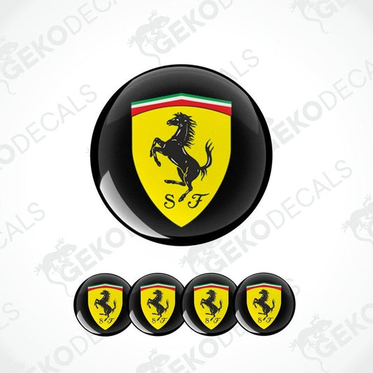 A set of four round black vinyl stickers with the Ferrari logo in red, yellow, and white colors.