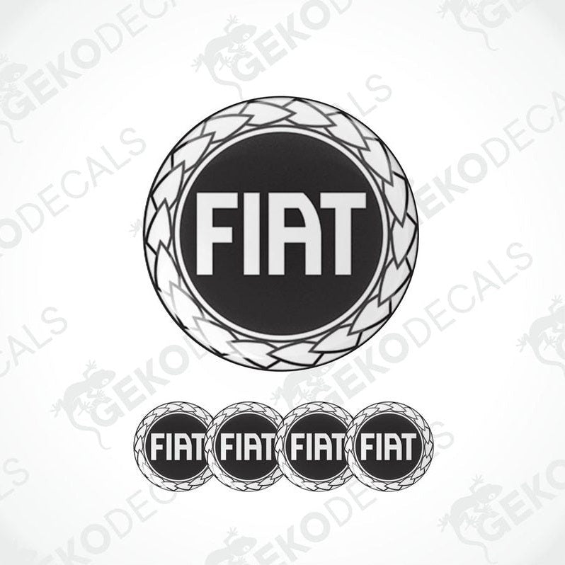 A set of four black vinyl stickers with the word 'FIAT' embossed on them, arranged in a circular pattern with a logo at the top.