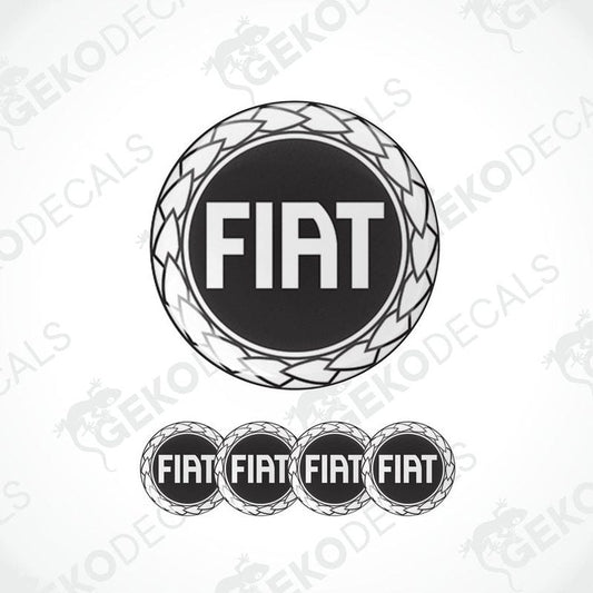 A set of four black vinyl stickers with the word 'FIAT' embossed on them, arranged in a circular pattern with a logo at the top.