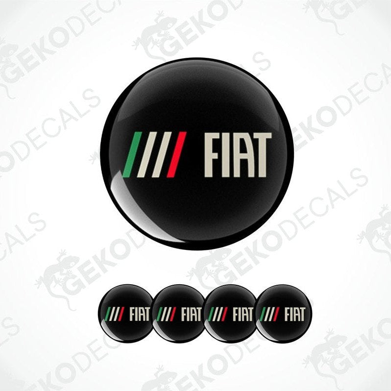A set of four round car decals with the Fiat brand logo, predominantly black with a colorful stripe and white lettering.