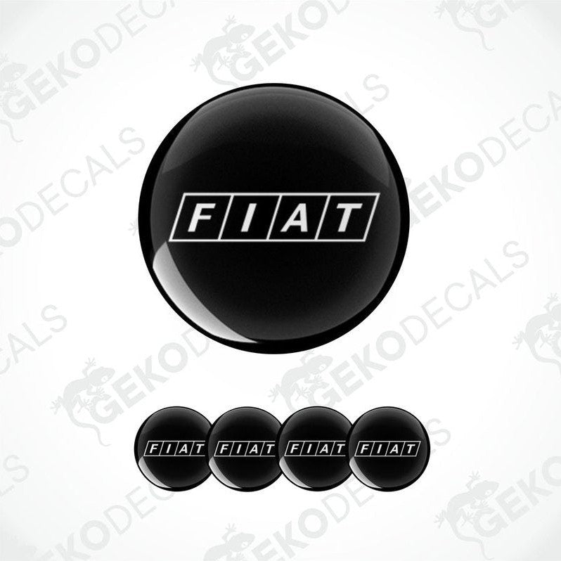 A set of four black and white car wheel decals with the brand name 'FIAT' on them.