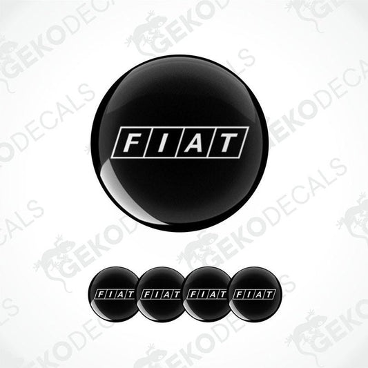 A set of four black and white car wheel decals with the brand name 'FIAT' on them.