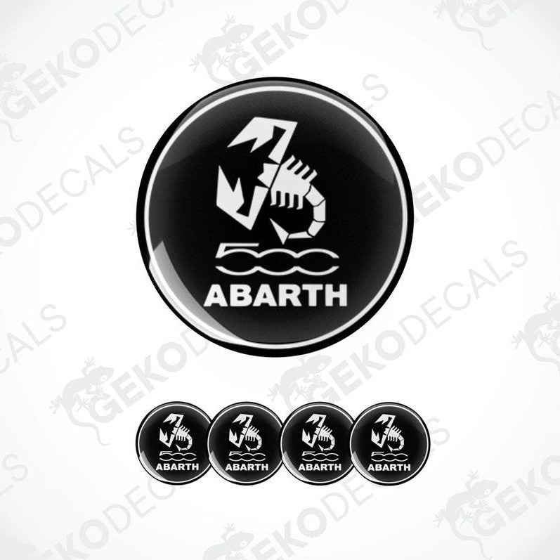 A set of four black vinyl stickers with the FIAT ABARTH logo and a scorpion graphic design.