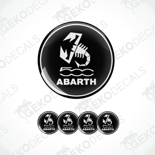 A set of four black vinyl stickers with the FIAT ABARTH logo and a scorpion graphic design.