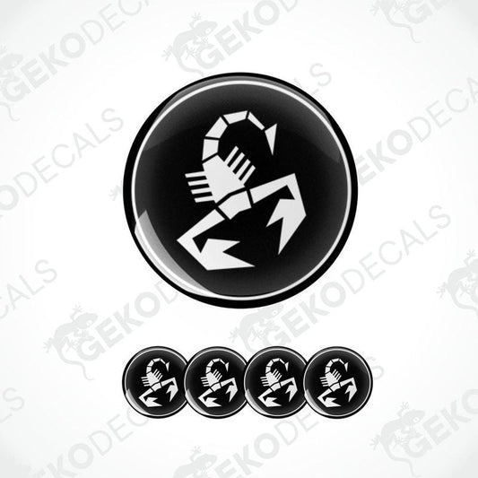 A set of black and white vinyl decals with a polyurethane coating, featuring a scorpion design, commonly associated with the Abarth brand.