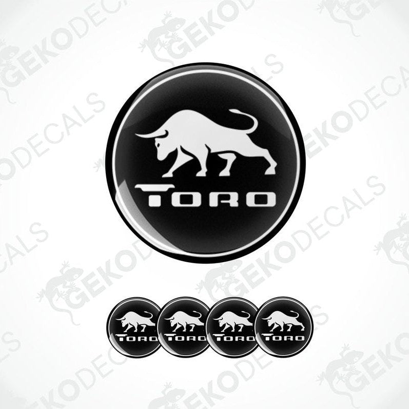 A set of black and white vinyl decals with the Toro brand logo, designed for use as car stickers.