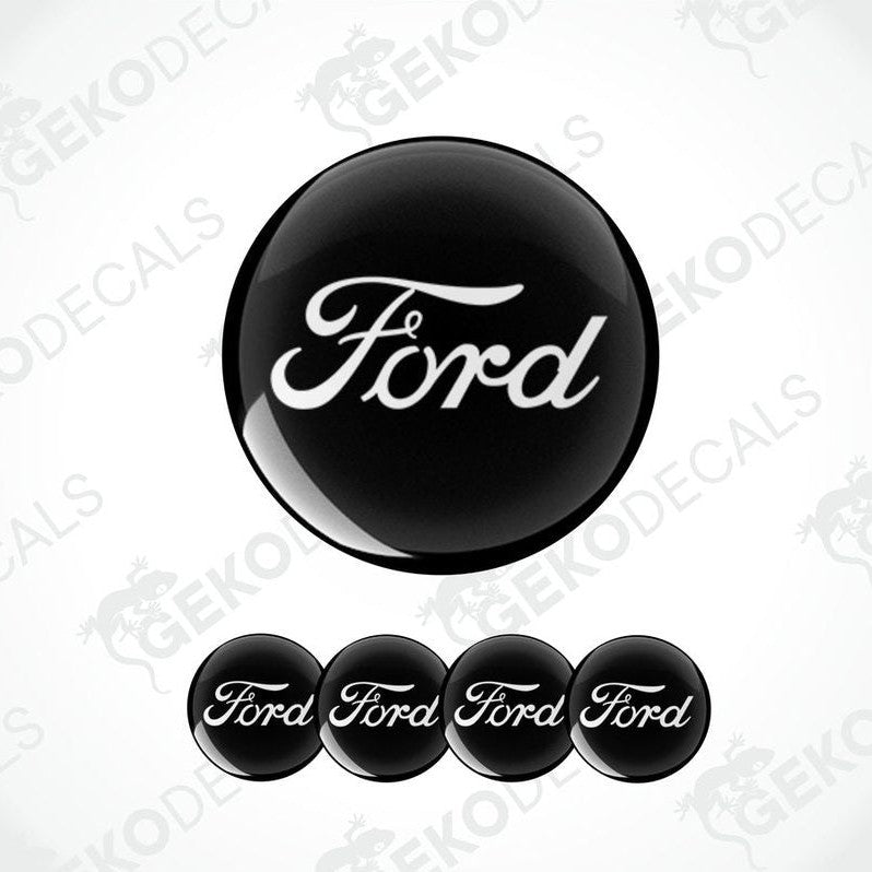 A set of four black and white Ford branded vinyl decals.