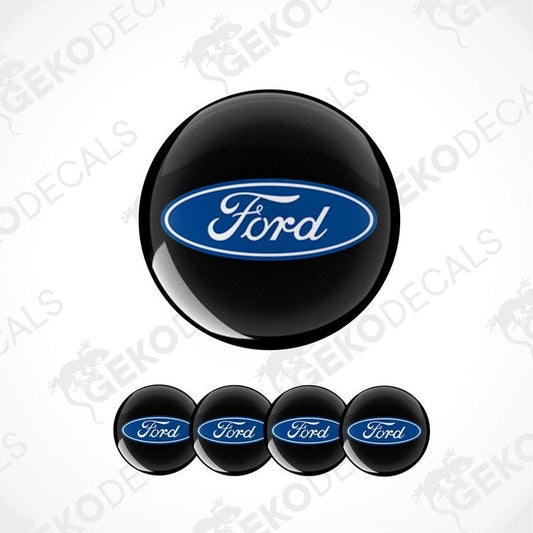 A set of four vinyl decals with the Ford logo, three are for wheels and one is for the car body.