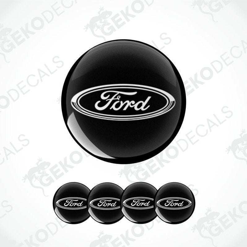 A set of black vinyl decals with the Ford logo, including four different sizes suitable for vehicle upholstery.