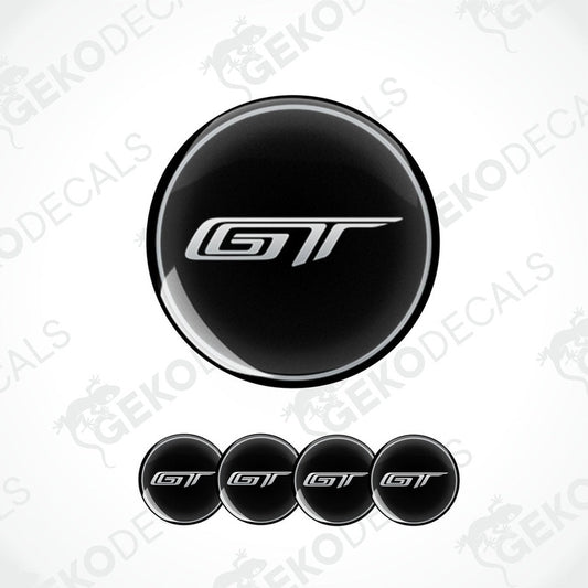 A set of four black vinyl stickers with the letter 'GT' and the FORD brand logo in white.