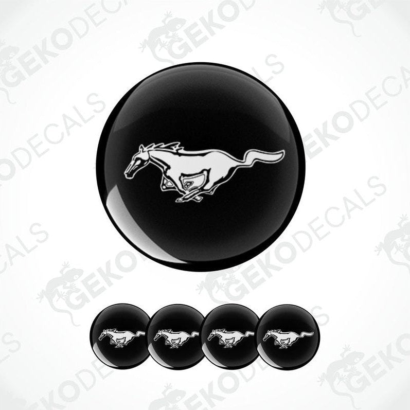 A set of four black and white vinyl decals with a Ford Mustang horse logo.