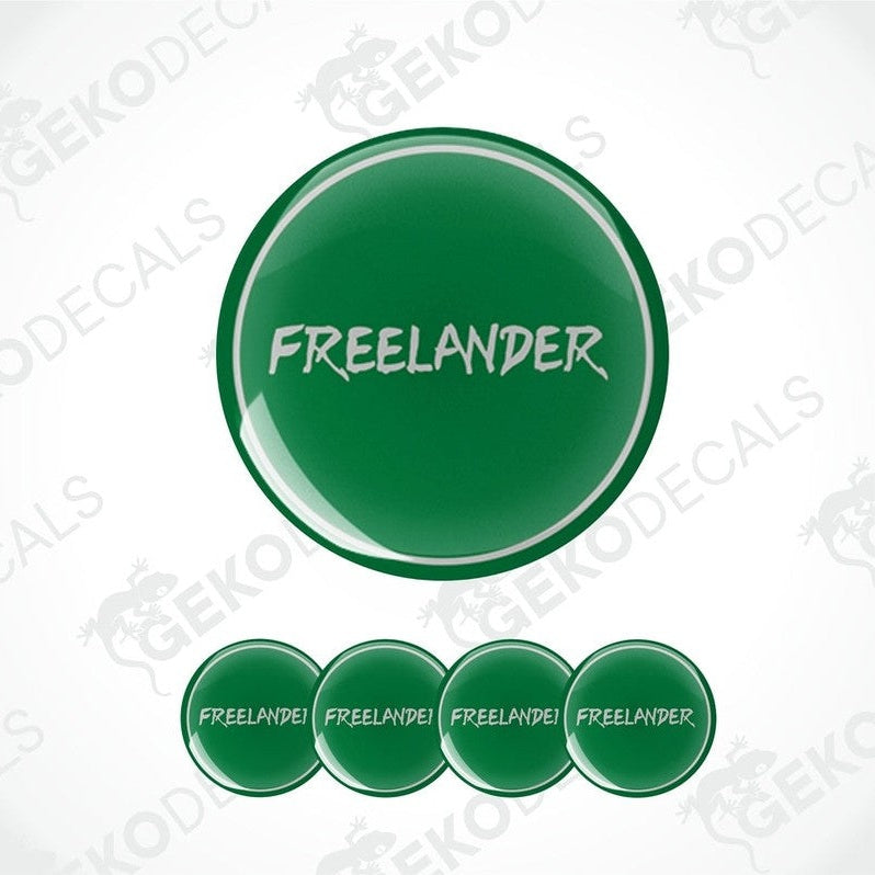 A set of four green vinyl decals with the word 'FREELANDER' printed on them, presented against a white background.