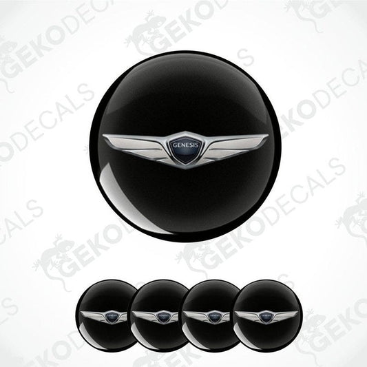 A set of four black vinyl stickers with a silver Genesis brand emblem in the center.