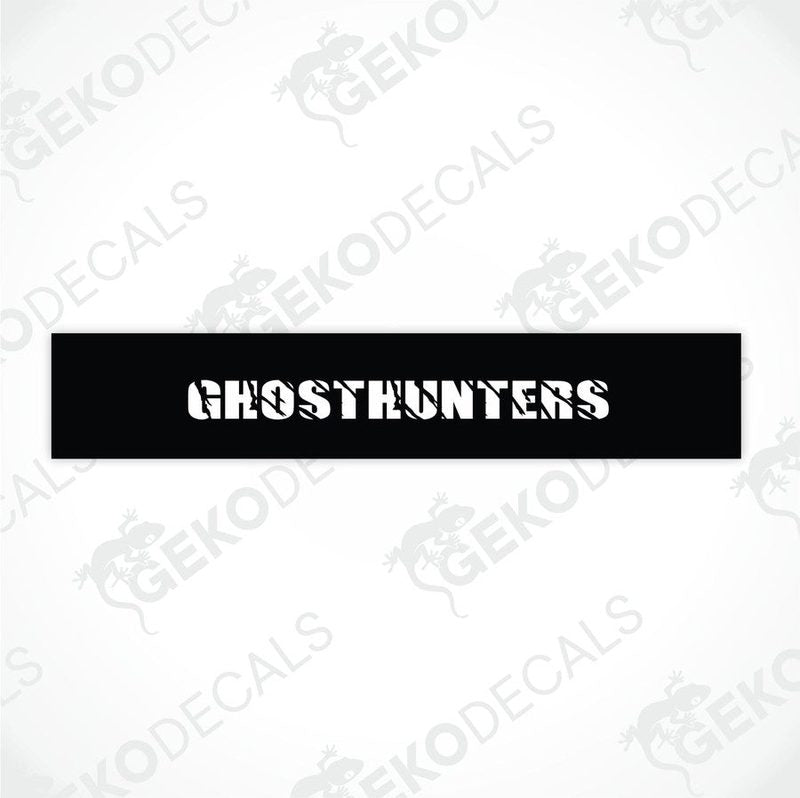 Black car windshield sun visor with white text CHOSTHUNTERS