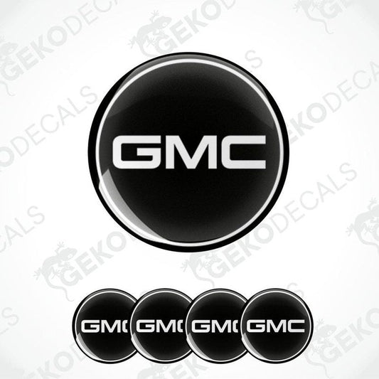 A set of four black and white vinyl decals with the GMC logo.