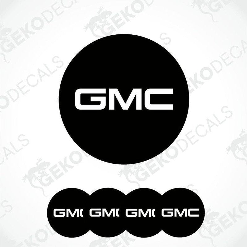 A set of four black round car decals with the GMC logo in white.